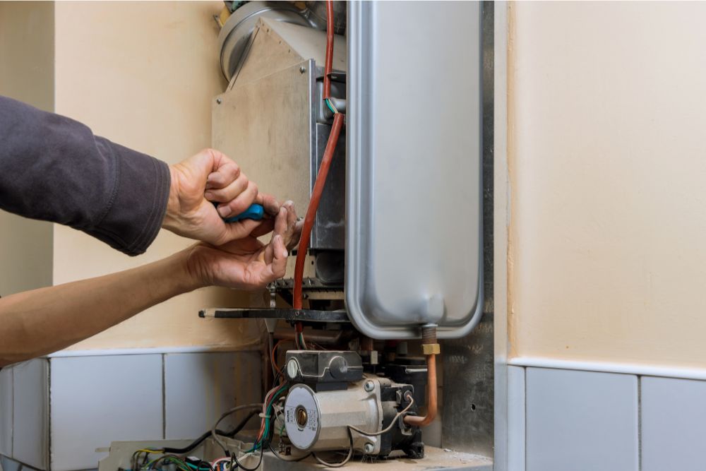 Technician repairing a califont water heater